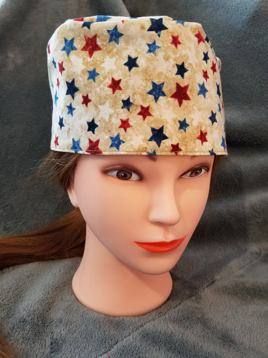 Beige Background with Red and Blue Stars Scrub Cap with hook and loop fasteners