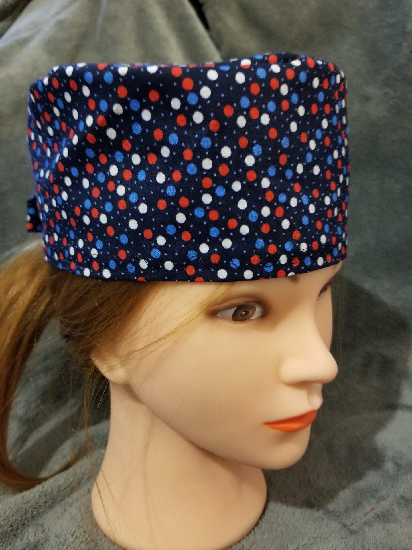 Blue Background with Red, White and Blue Dots Scrub Cap with hook and loop fasteners