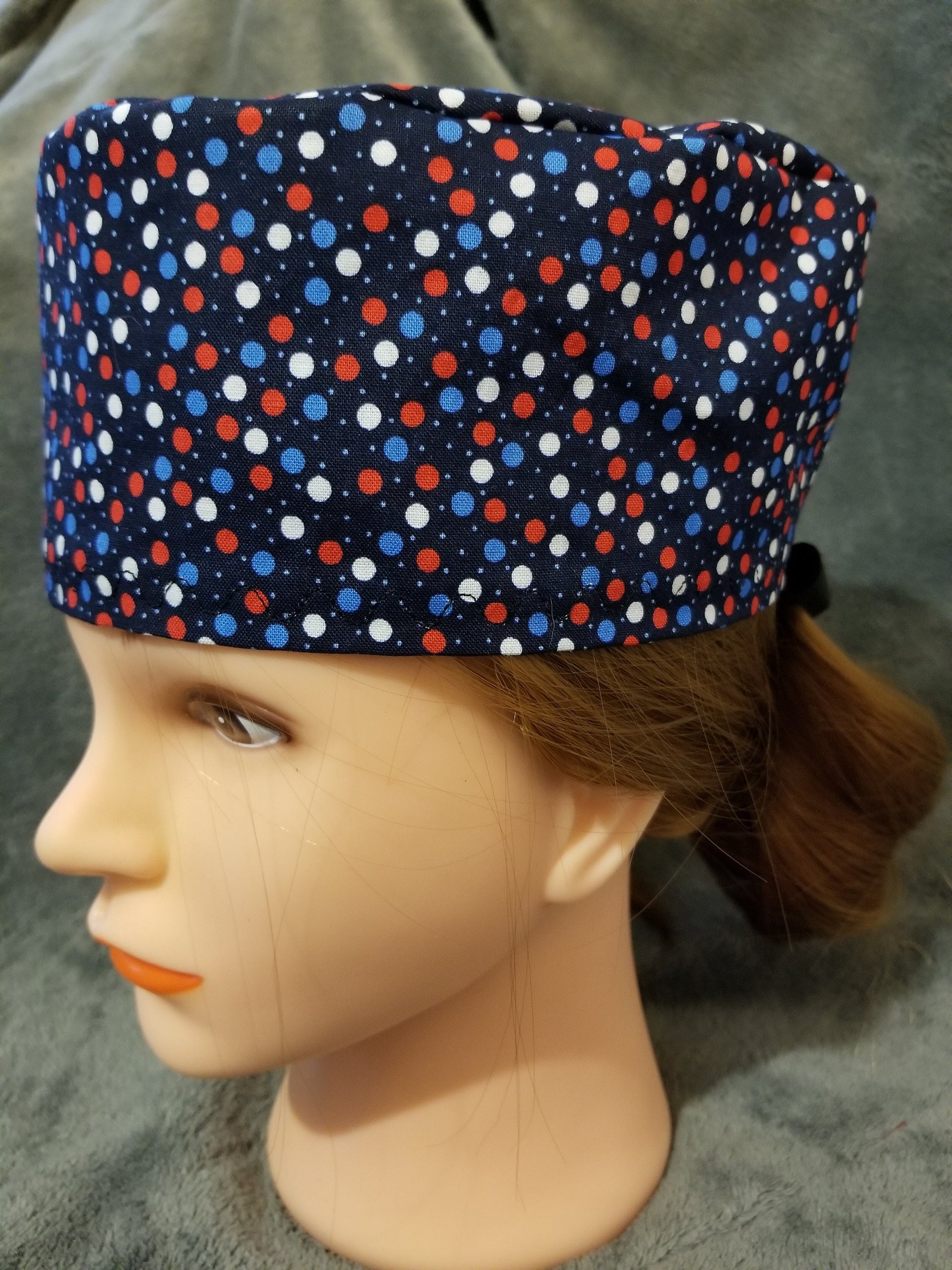 Blue Background with Red, White and Blue Dots Scrub Cap with hook and loop fasteners