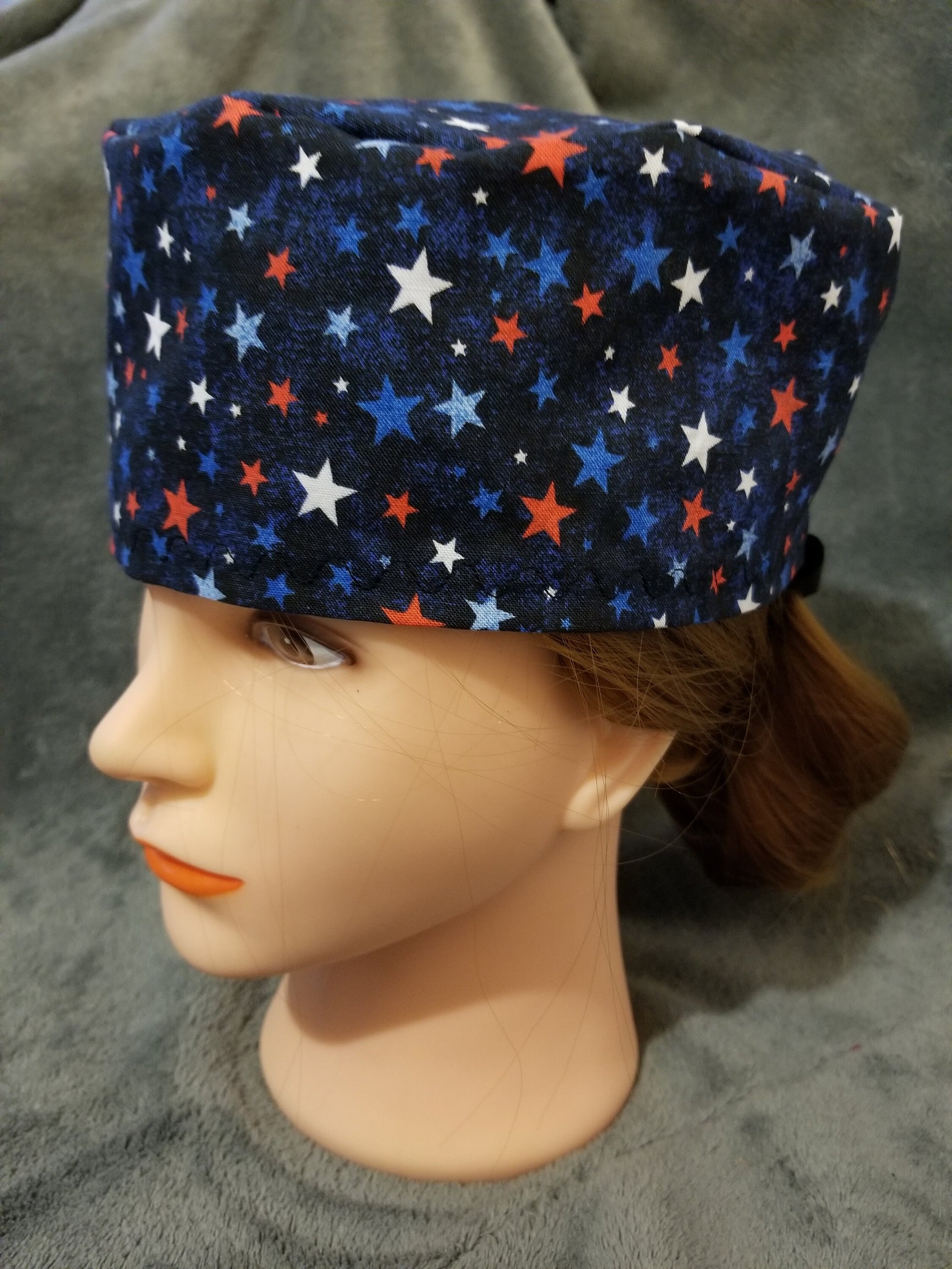 Blue Background with Red, White and Blue Stars Scrub Cap with hook and loop fasteners